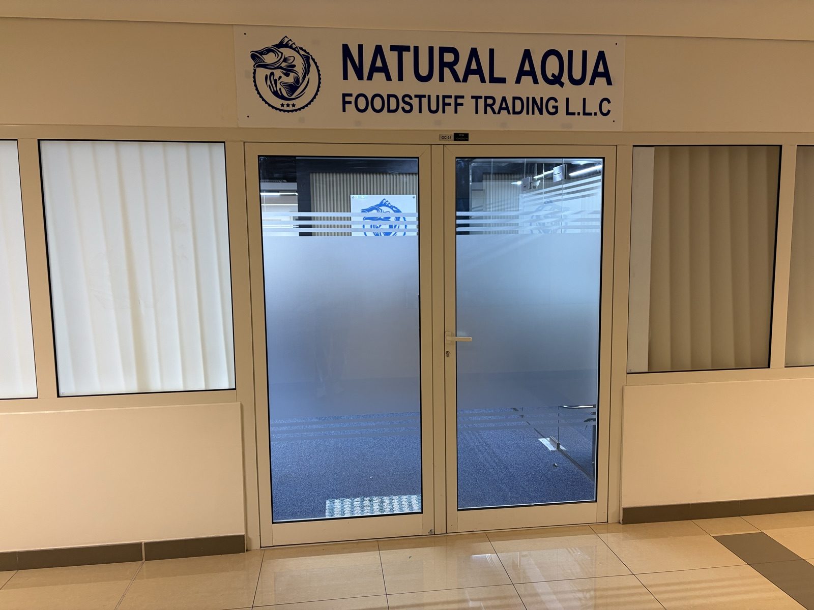 Natural Aqua office entrance with company sign