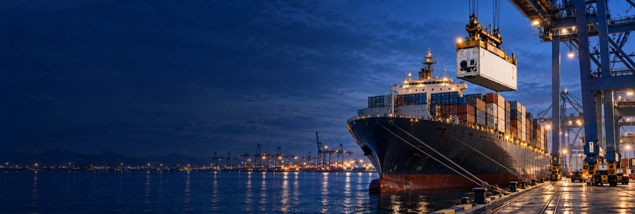 Vessel at port with a refrigerated container being unloaded